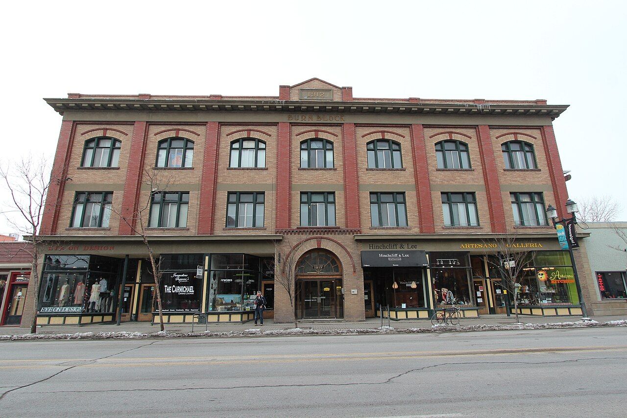 Historic brick building with storefronts on 9 Avenue SE in Inglewood